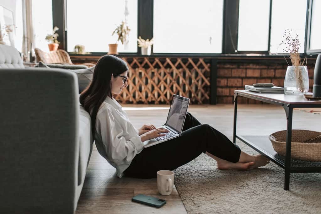 Woman working at home with her laptop